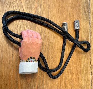 M Brown - Hand Holding Bolo Tie